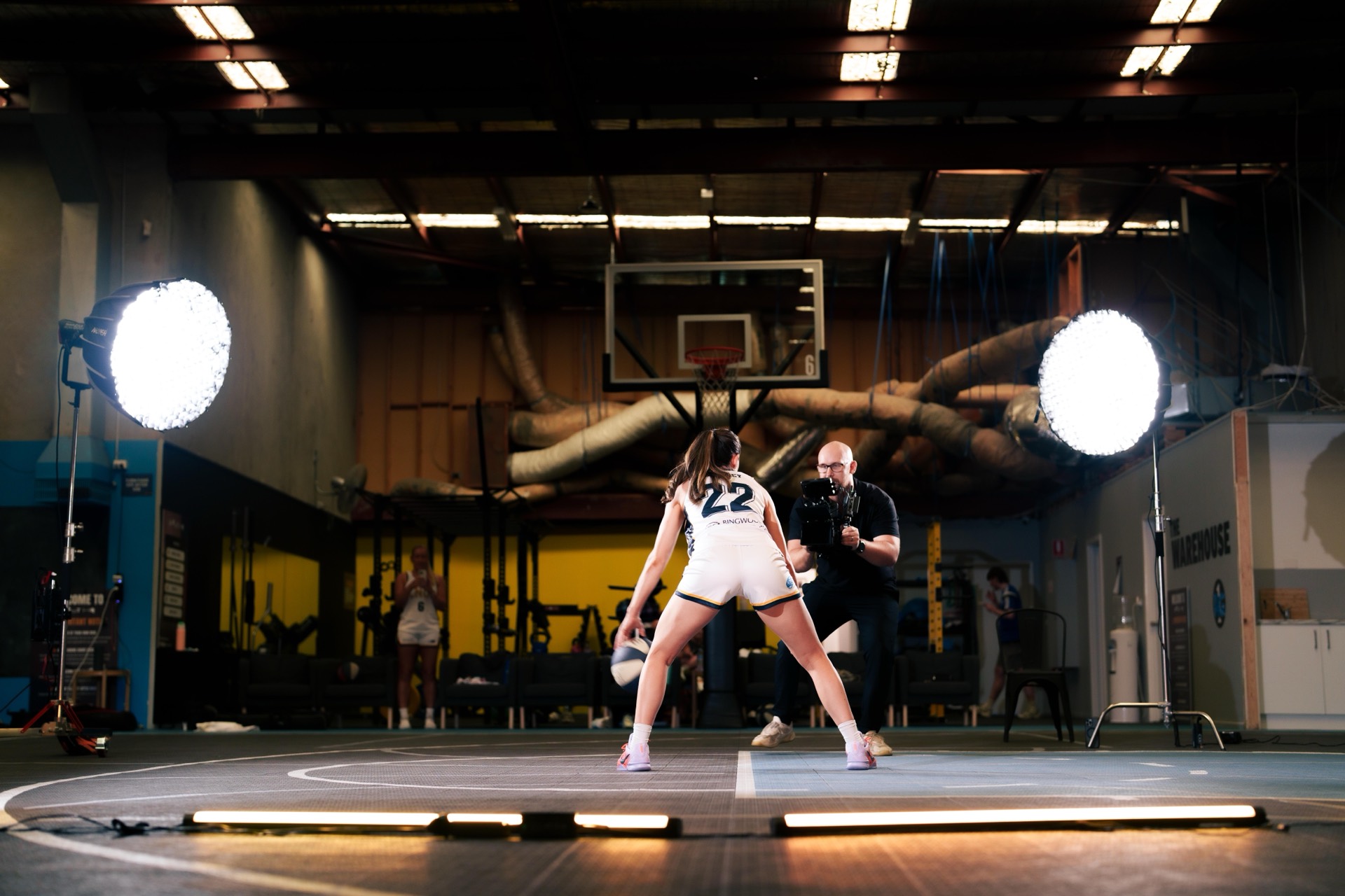Controlled Chaos Studios filming a basketball media day on court in Melbourne