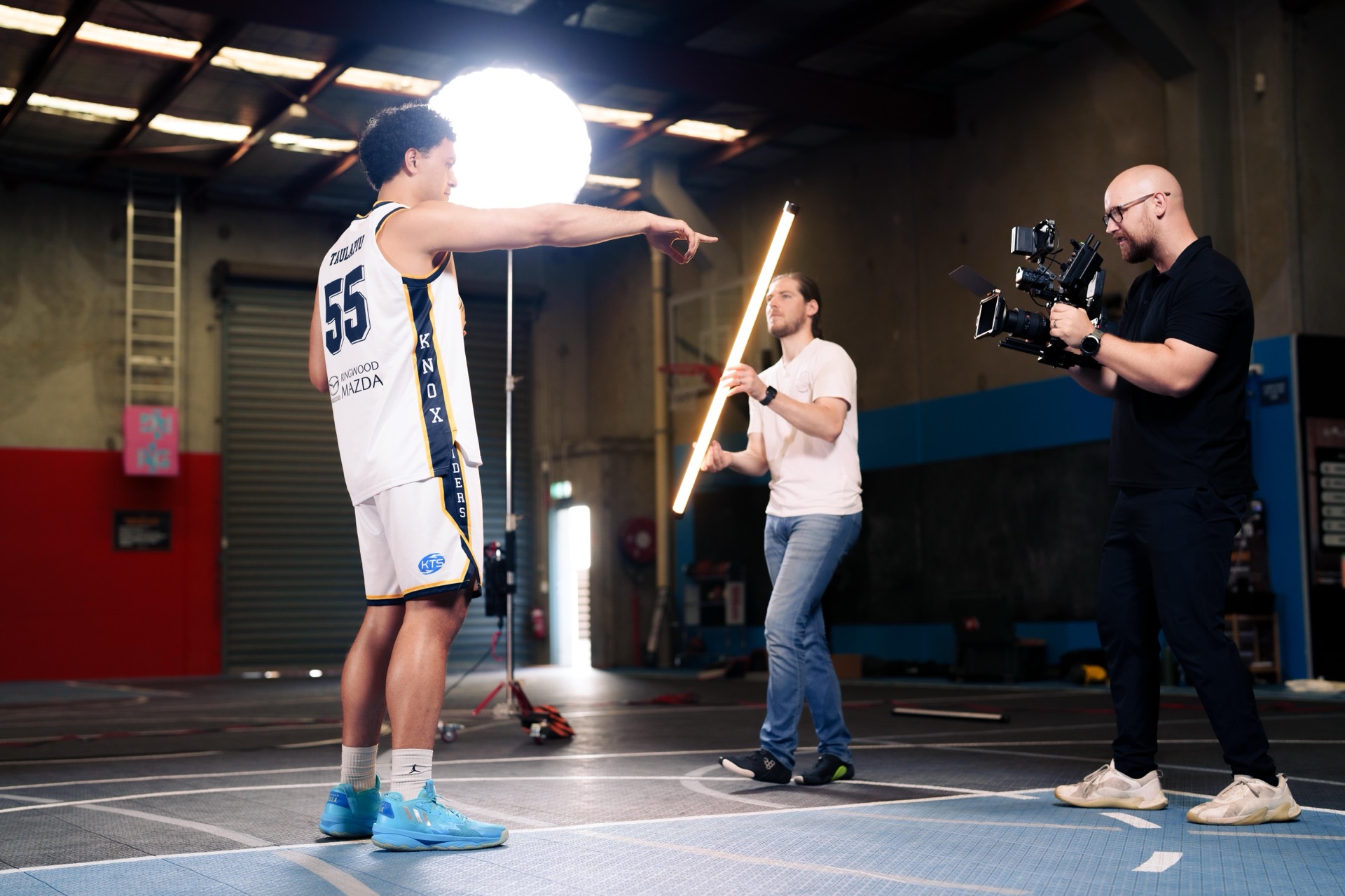Basketball player filmed with a cinema tube light at a media day shoot