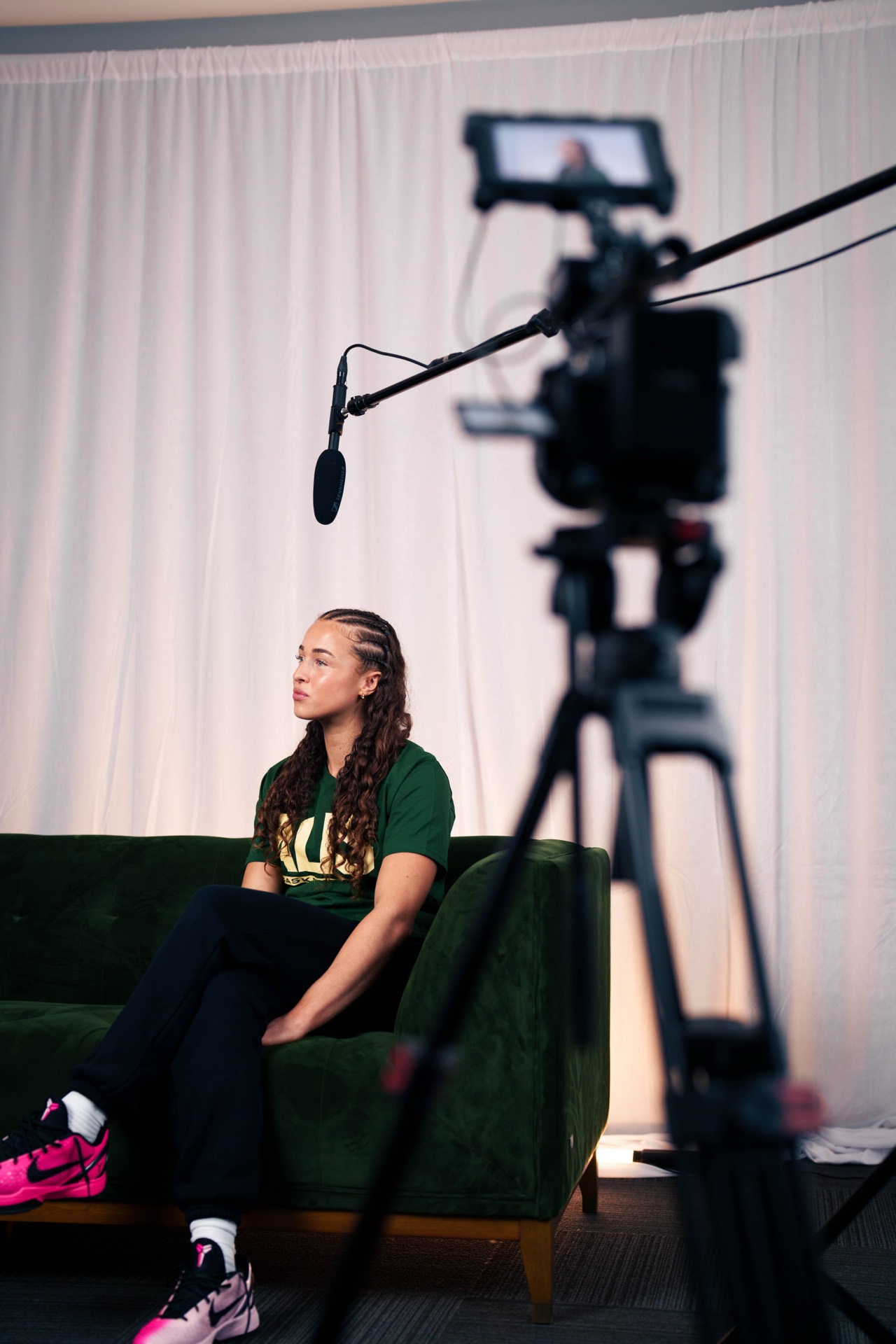 Australian basketball player interviewed on set for a documentary